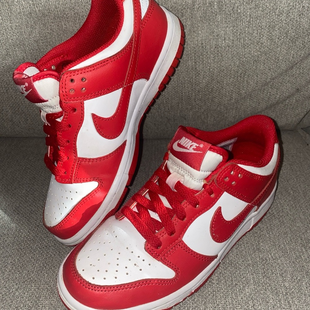 Nike Kids Dunk Low in the white and University Red "St. John's" colorway